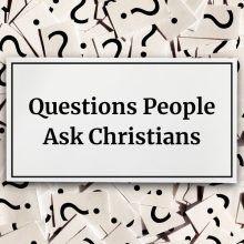 card layered on top of question marks